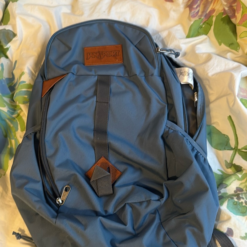 Jansport blue backpack with laptop sleeve and drink holder; Gently Used